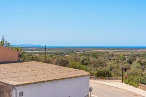 Serene patios surrounded by nature and filled with a calming glow in Ses Salines homes